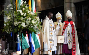 Pallbearers carry the coffin of South African anti-Apartheid icon Archbishop Desmond Tutu to the hearse after the requiem mass of Tutu at St. Georges Cathedral in Cape Town on January 1, 2022.