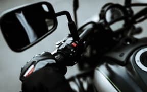 Hand Of A Biker Laying On Motorcycle Steering. Going For Ride. Speed Vehicle. Motorbike Concept. Tripping Together. Speed Choosing. Journey Start. Ready To Go. Power Button. Black Jacket.