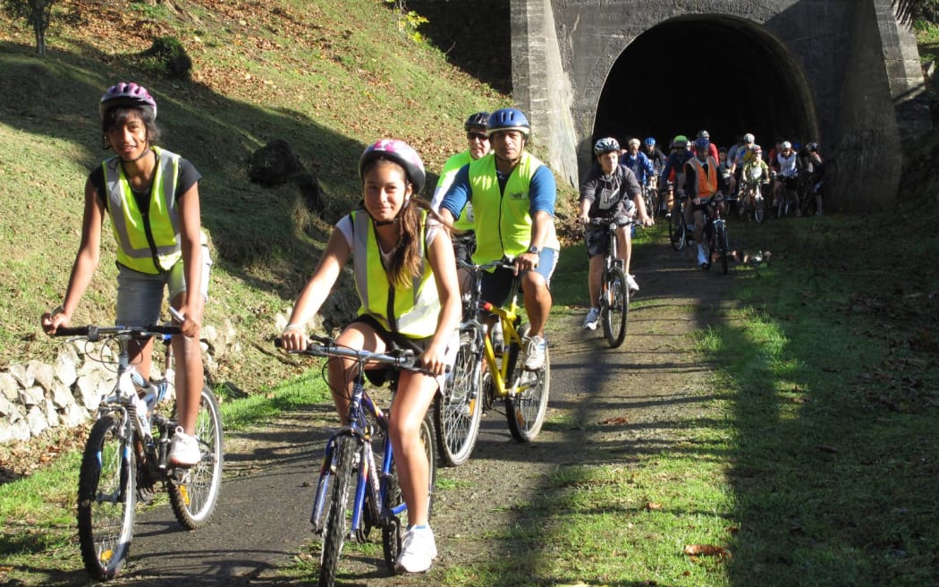 New Zealand’s northernmost rail tunnel, seen here when the first section of the Twin Coast Cycle Trail opened in 2011, passes under Ōkaihau’s main street.