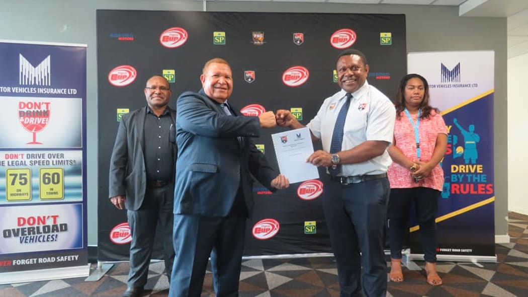 Motor Vehicles Insurance Limited Managing Director, Michael Makap (left), confirmed sponsorship for the Digicel Cup alongside Competition Manager Stanley Hondina.