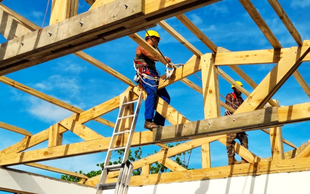 Marine infantry regiment (RIMAP) at work on a roof of primary schools in Port Vila (PICTURE French Defence ministry)