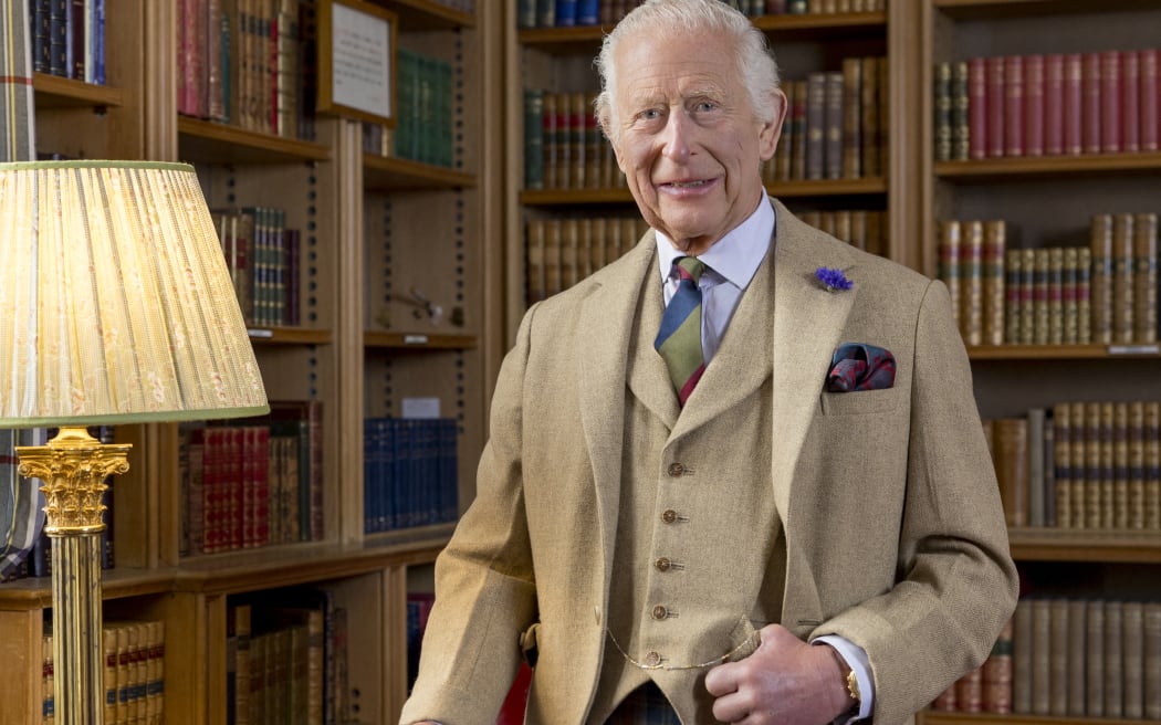 This handout photograph released by Buckingham Palace on January 25, 2025, shows Britain's King Charles III, posing for a photograph in the library at Balmoral, Scotland in Autumn 2024. The King is wearing a kilt made from The King Charles III tartan in a photograph released to mark Burns Night. (Photo by Millie Pilkington / BUCKINGHAM PALACE / AFP) / NO USE AFTER FEBRUARY 8, 2025 12:40:30 GMT - NO USE AFTER FEBRUARY 8, 2025 12:40:30 GMT - XGTY / RESTRICTED TO EDITORIAL USE - MANDATORY CREDIT "AFP PHOTO / MILLIE PILKINGTON / BUCKINGHAM PALACE " - NO SALES - NO MARKETING - NO ADVERTISING CAMPAIGNS - NO DIGITAL ALTERATION ALLOWED  - DISTRIBUTED AS A SERVICE TO CLIENTS - TO BE USED TO ILLUSTRATE THE EVENT MENTIONED IN THE CAPTION - NOT TO BE USED AFTER FEBRUARY 8, 2025 /