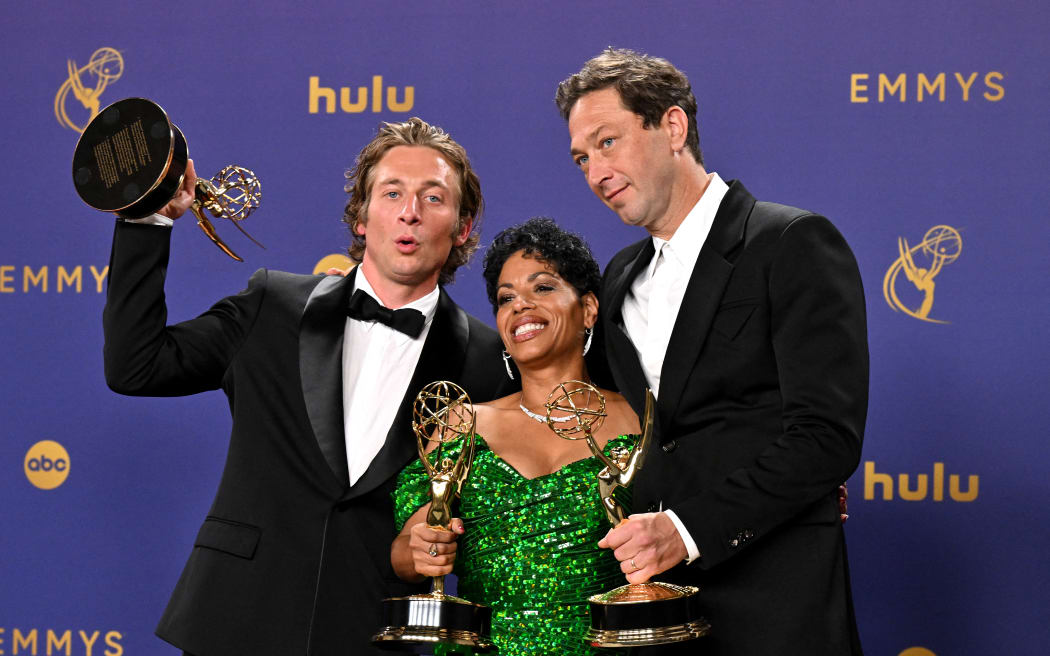US actor Jeremy Allen White (L), poses in the press room with the award for Outstanding Lead Actor in a Comedy Series for "The Bear", US actress Liza Colon-Zayas (C) poses in the press room with the award for Outstanding Supporting Actress in a Comedy Series for "The Bear", US actor Ebon Moss-Bachrach (R) poses in the press room with the award for Outstanding Supporting Actor in a Comedy Series for "The Bear"  during the 76th Emmy Awards at the Peacock Theatre at L.A. Live in Los Angeles on September 15, 2024. (Photo by Robyn Beck / AFP)