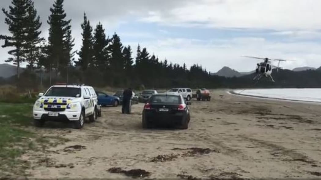 The helicopter spilled some of the liquid at a beach while refueling.
