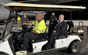 Winston Peters is transported on the tarmac from RNZAF aircraft after landing in Nukualofa