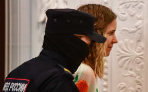 Darya Trepova, charged with killing military blogger Vladlen Tatarsky, attends her verdict hearing at a court in Saint Petersburg on January 25, 2024.  (Photo by Olga MALTSEVA / AFP)