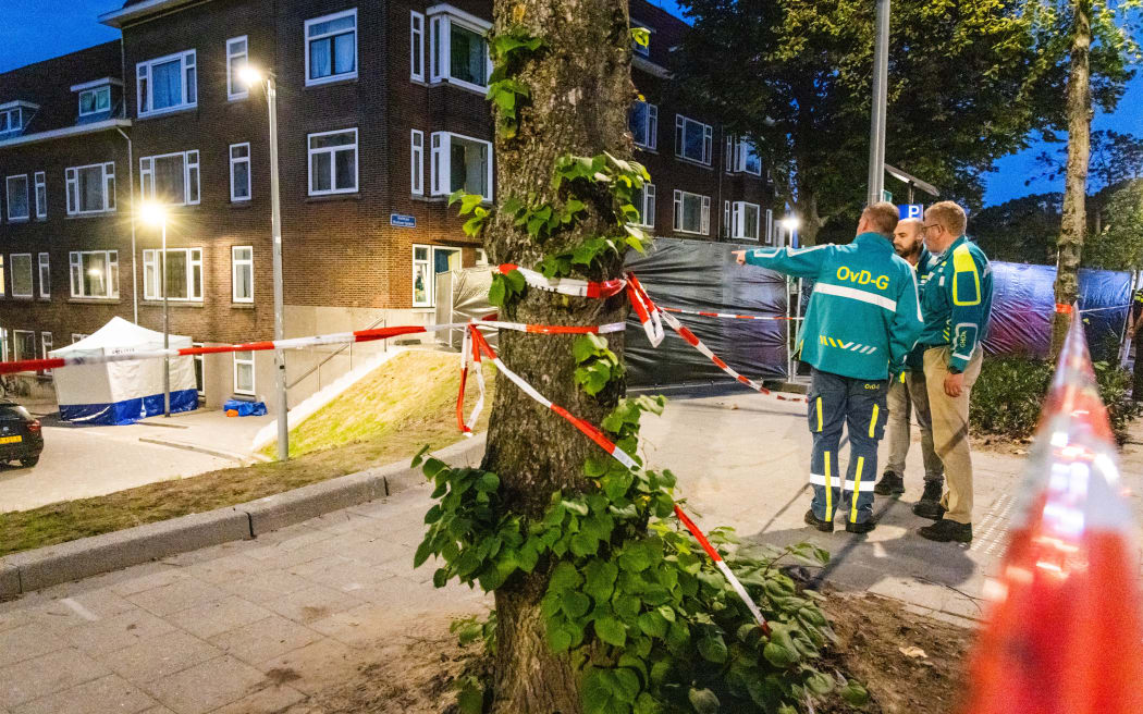 ROTTERDAM - The police and fire brigade are investigating the building on Heiman Dullaertplein where a 32-year-old man shot a 39-year-old woman and her 14-year-old daughter. The perpetrator shot a 43-year-old man in a classroom of the Erasmus Medical Center. The three victims have died. ANP JEFFREY GROENEWEG netherlands out - belgium out (Photo by ANP MAG / ANP via AFP)