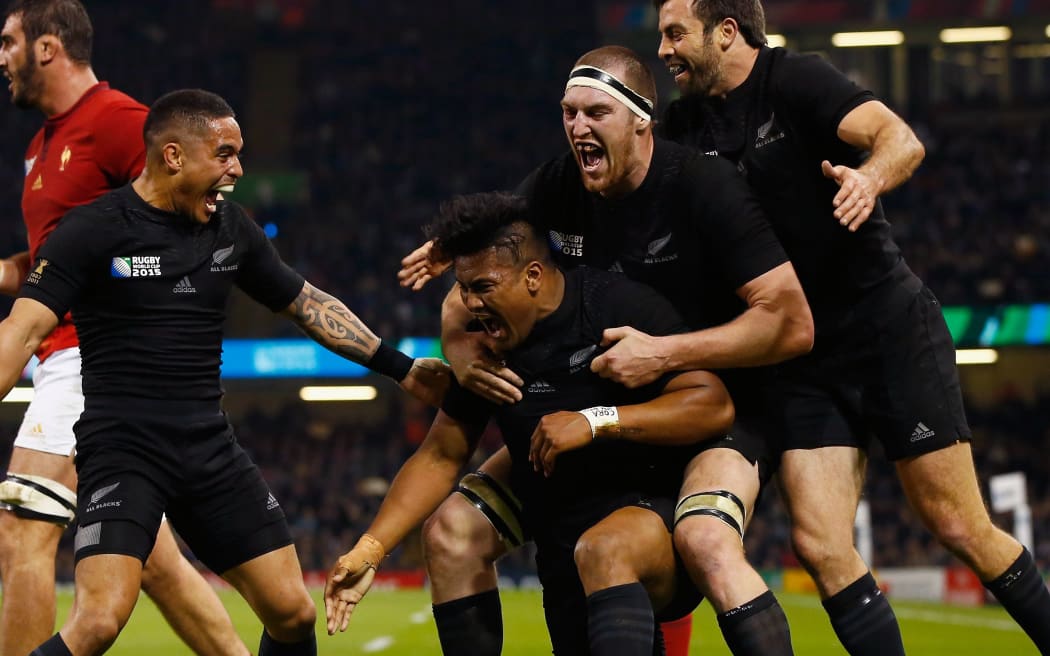 The All Blacks players celebrate with try scorer Julian Savea during the 2015 Rugby World Cup Quarter Final against France.