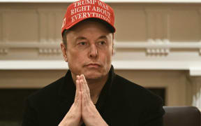 (FILES) Elon Musk looks on as US President Donald Trump hosts a cabinet meeting in the Cabinet Room of the White House on March 24, 2025, in Washington, DC. Musk's rise as President Donald Trump's all-powerful wingman was as rapid and unstoppable as one of his SpaceX rockets. But reports April 2, 2025 are fueling speculation that the billionaire's political career may be coming back to Earth. Politico and ABC News quoted unnamed sources saying Musk could step away from an unprecedented role in which he is spearheading brutal cuts to US government services and has emerged only second to Trump as the face of the administration. (Photo by Brendan SMIALOWSKI / AFP)