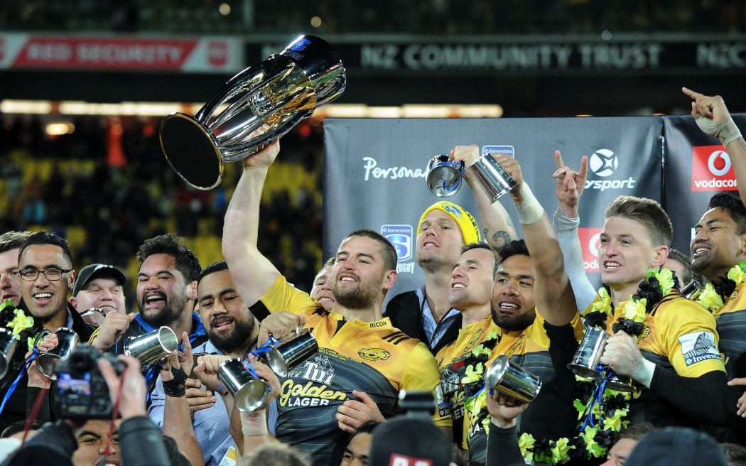 Hurricanes captain Dane Coles with the Super Rugby trophy following the win over the Lions in Wellington.