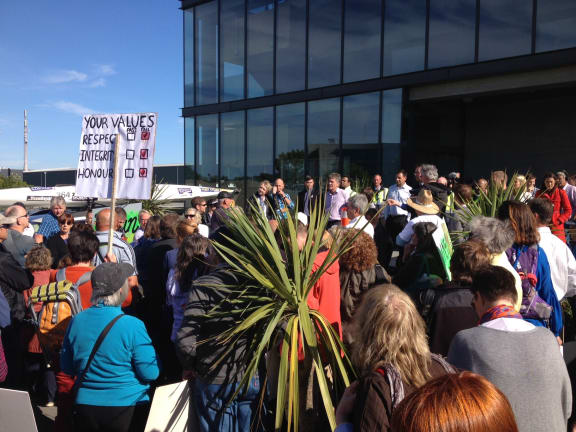 Protesters outside the Southern Response office in Christchurch.