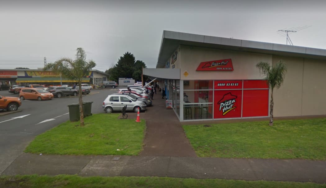 A woman was stabbed outside the Bairds Road Pizza Hut.