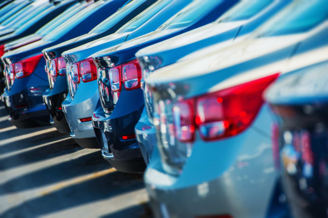 Parked cars for sale, car yard.