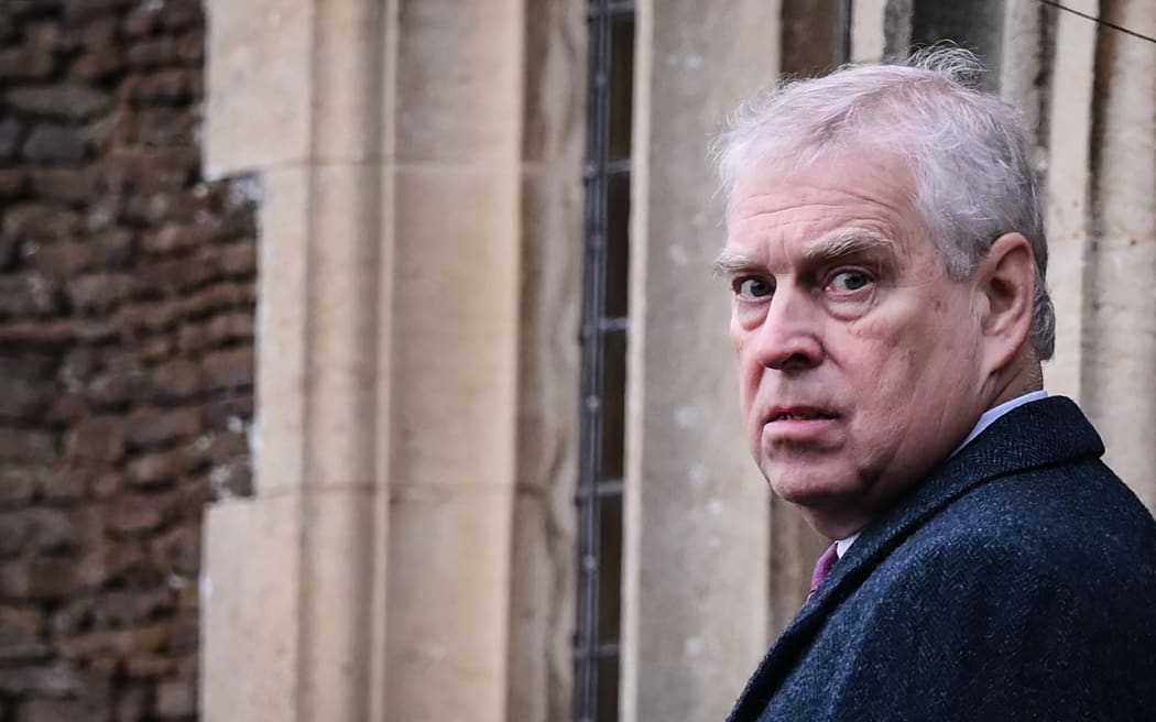 Britain's Prince Andrew, Duke of York reacts as he arrives for the Royal Family's traditional Christmas Day service at St Mary Magdalene Church in Sandringham, Norfolk, eastern England, on December 25, 2022.