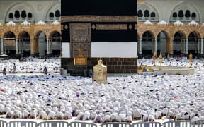 Muslim worshippers pray around the Kaaba, Islam's holiest shrine, at the Grand Mosque in Saudi Arabia's holy city of Mecca on June 4, 2024 as pilgrims arrive ahead of the annual hajj pilgrimage. (Photo by Abdel Ghani BASHIR / AFP)