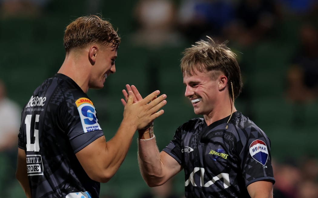 Jordi Viljoen of the Hurricanes is congratulated by Ruben Love after scoring a try during the Super Rugby Pacific Round 1 match between the Western Force and the Hurricanes at HBF Park in Perth, Friday, February 23, 2024. (AAP Image/Richard Wainwright / www.photosport.nz)