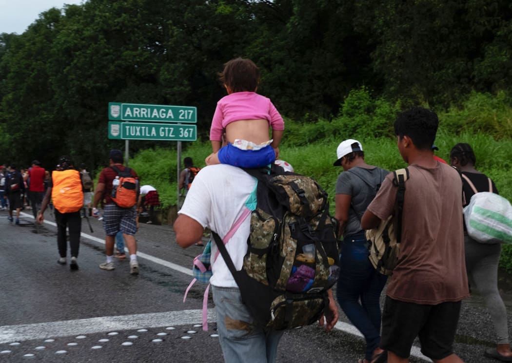 Central American and Haitian migrants are seen heading in a caravan to the US, in Huixtla, Chiapas State, Mexico, on September 4, 2021.