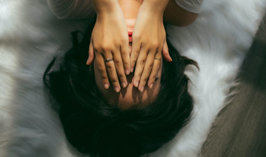 girl with hands on face