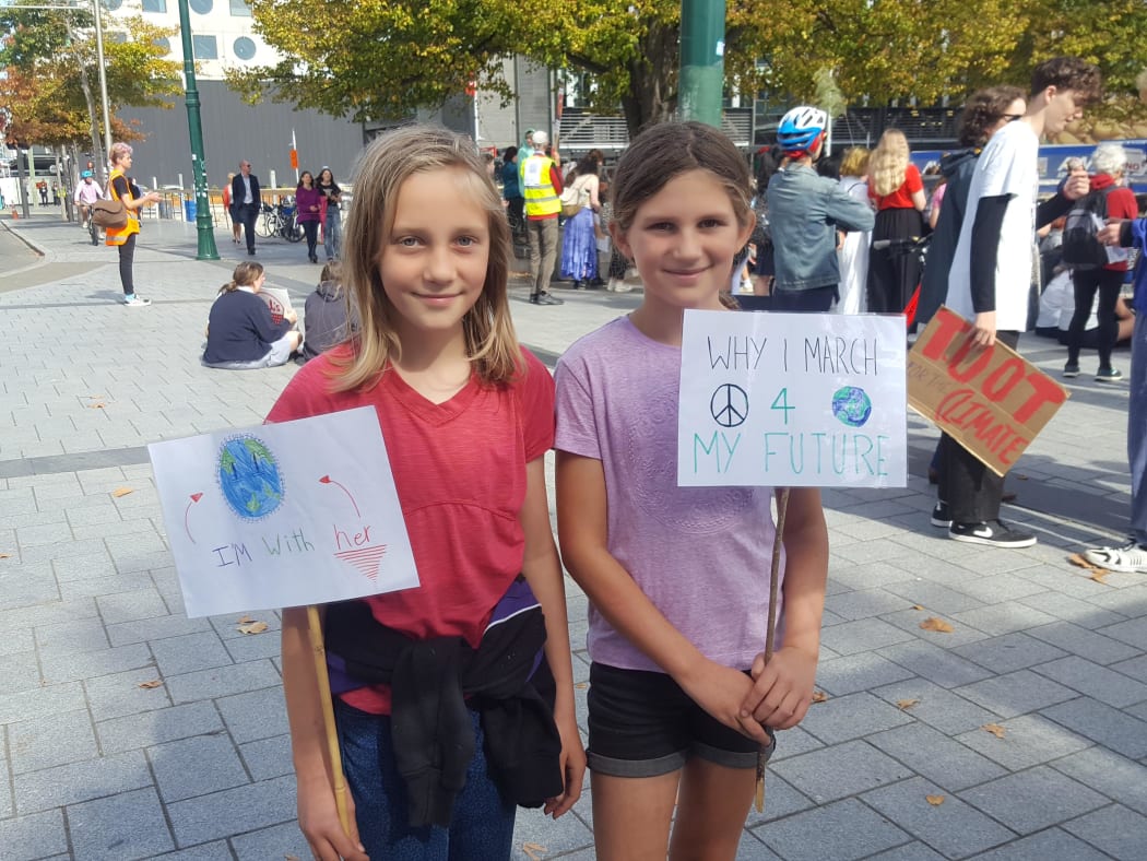 Fleur Harris, 11, and Nela Hammer, 10, protesting in Christchurch.