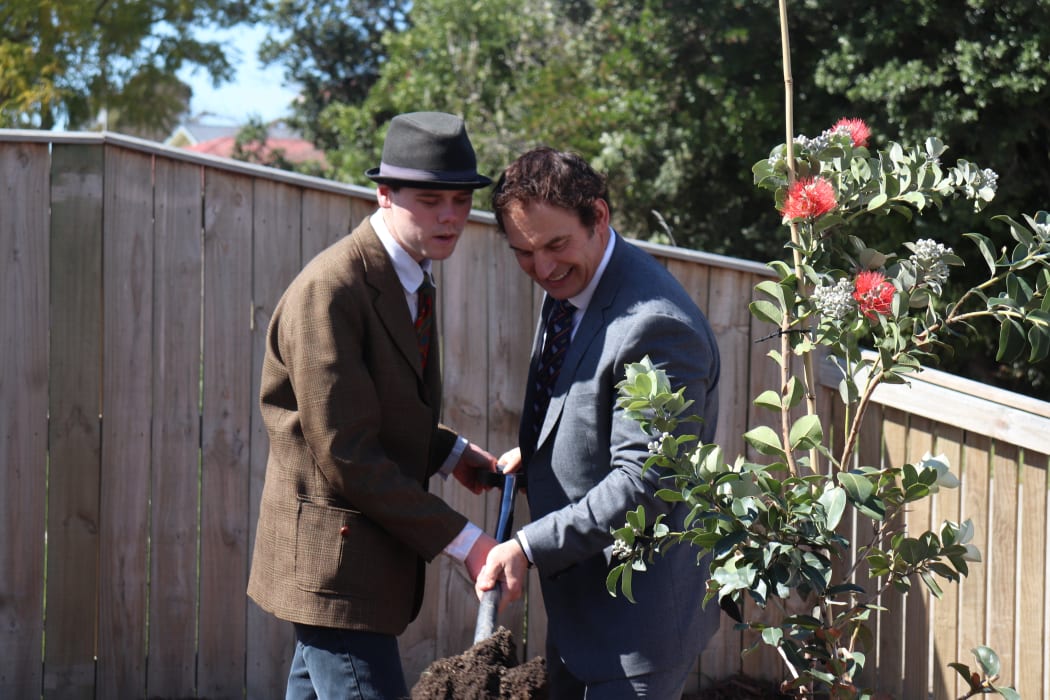 Hohepa resident Ryan Gedye and Napier MP Stuart Nash plant a tree outside one of the homes.