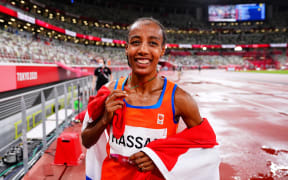 Netherlands' Sifan Hassan celebrates winning the women's 5000m final during the Tokyo 2020 Olympic Games at the Olympic Stadium in Tokyo on August 2, 2021.