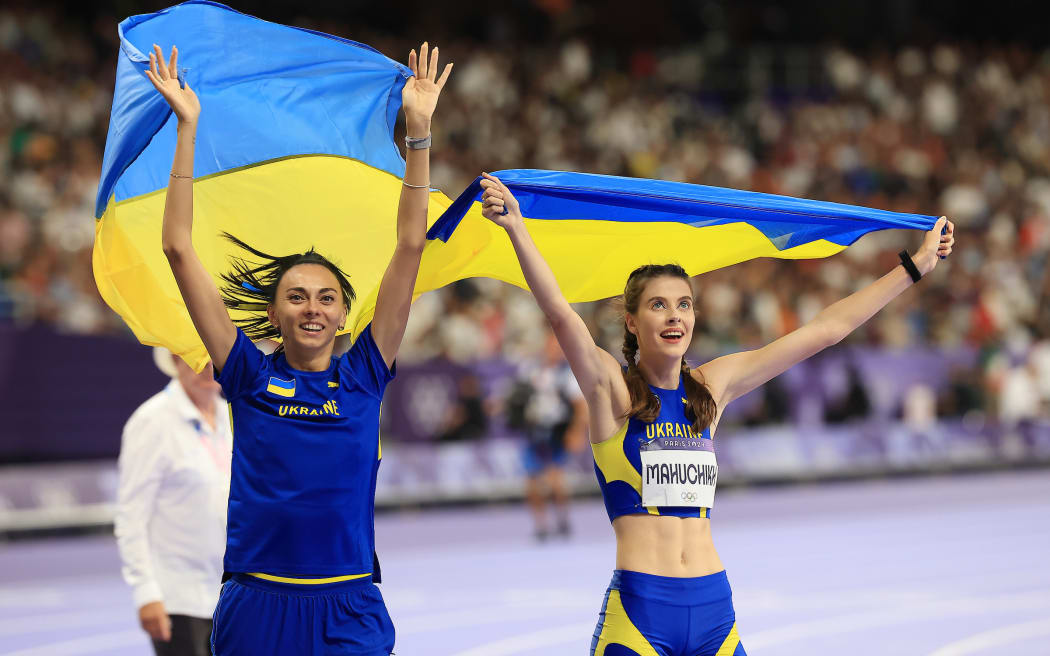 Iryna Gerashchenko (left) celebrates her bronze with Yaroslava Mahuchikh who won gold, - both from Ukraine in the womens high jump final at Stade de France, Paris, France on Thursday 4 August 2024. Photo credit: Iain McGregor / www.photosport.nz