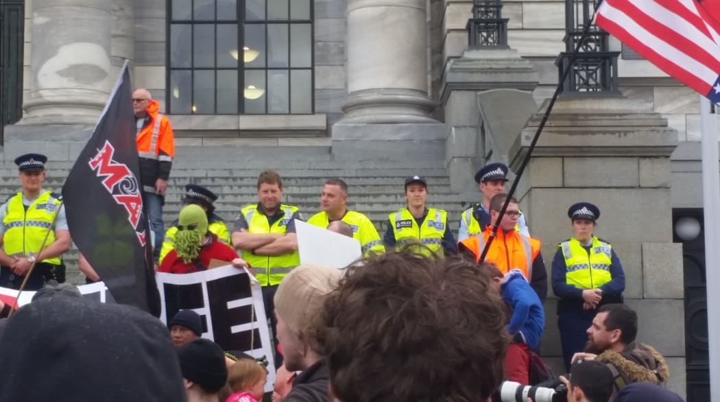 Police hold their line at Parliament against the protesters