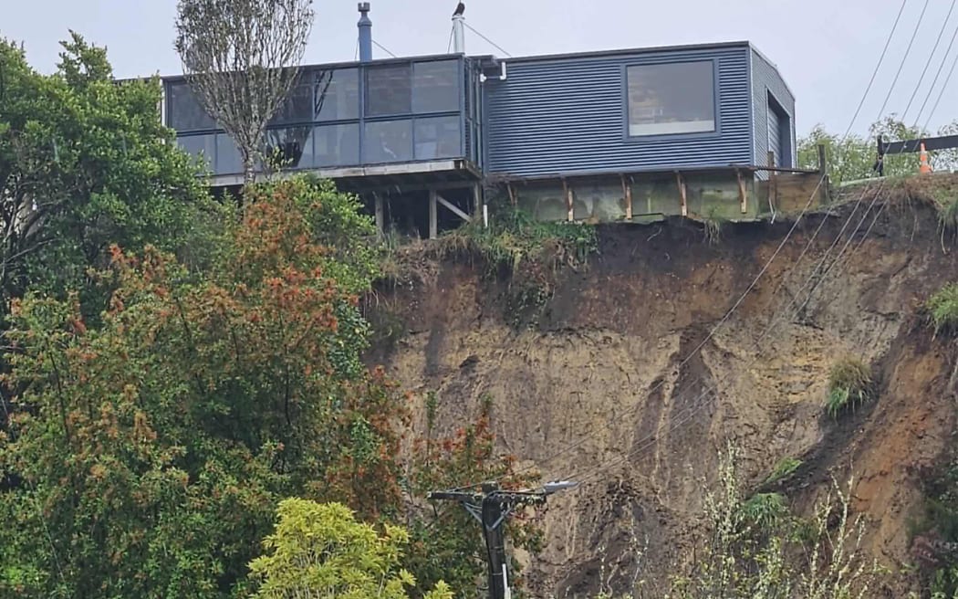 Modern house perched on the edge above a slip