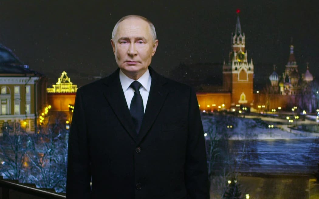In this video grab distributed by the Russian state agency Sputnik on December 31, 2024, Russia's President Vladimir Putin delivers his New Year's address to the nation at the Kremlin in Moscow. (Photo by POOL / AFP)