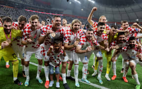 Croatia's players celebrate with their medals after winning the Qatar 2022 World Cup third place play-off football match between Croatia and Morocco at Khalifa International Stadium in Doha on December 17, 2022. (Photo by JACK GUEZ / AFP)
