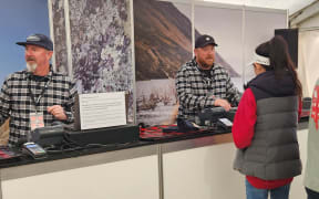 Swanndri tent at Fieldays - head of sales Nic Floyd processing a sale