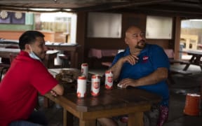 Patrons at the West Alabama Ice House have beers before Texas Governor Greg Abbotts order that all bars are to be closed at noon today in Houston, Texas on June 26, 2020.