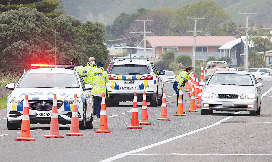 Police question drivers at a static checkpoint in Okitu, Wainui on Tuesday morning.