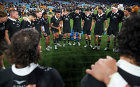The All Blacks huddle post-game.