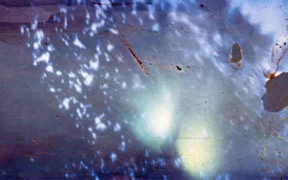 Clay, stone, sticks, frond stem of mamaku, water, light, 87 centimeters x 2.5 meters, Archival Inkjet Print, 2023