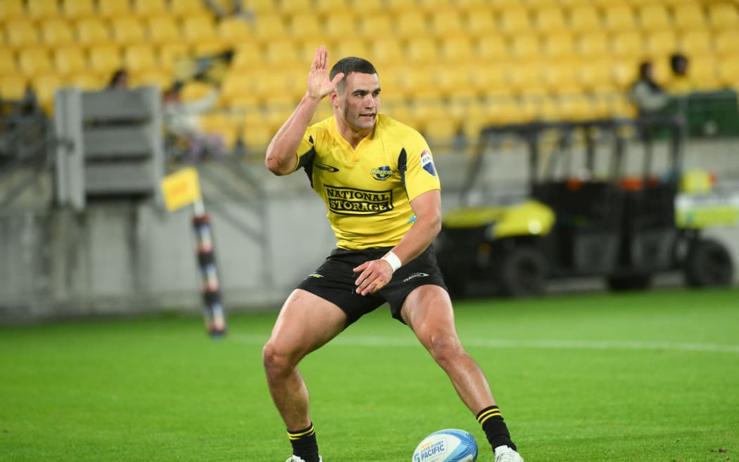 Josh Moorby of the Hurricanes  celebrates his try during their Super Rugby Pacific match against the Waratahs at Sky Stadium.
