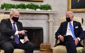 US President Joe Biden (R) holds a bilateral meeting with Britain's Prime Minister Boris Johnson at the Oval Office of the White House in Washington, DC on September 21, 2021.