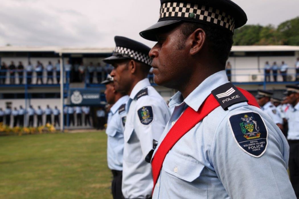 Solomon Islands Police officers at the official limited-rearmament ceremony marking the first time in 14 years that RSIPF officers gave been allowed to carry guns.