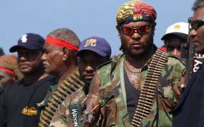 Militants surrender arms in 2003