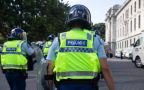 Protestors and Police standoff as police move concrete barricades
