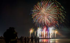 Fireworks illuminate the sky above the New Brighton Pier during Christchurch's first-ever Matariki fireworks spectacular in Christchurch, New Zealand on July 10, 2021. The Matariki is an annual new year celebration of the Maori's, the indigenous people of New Zealand. (Photo by Sanka Vidanagama/NurPhoto) (Photo by SANKA VIDANAGAMA / NurPhoto via AFP)