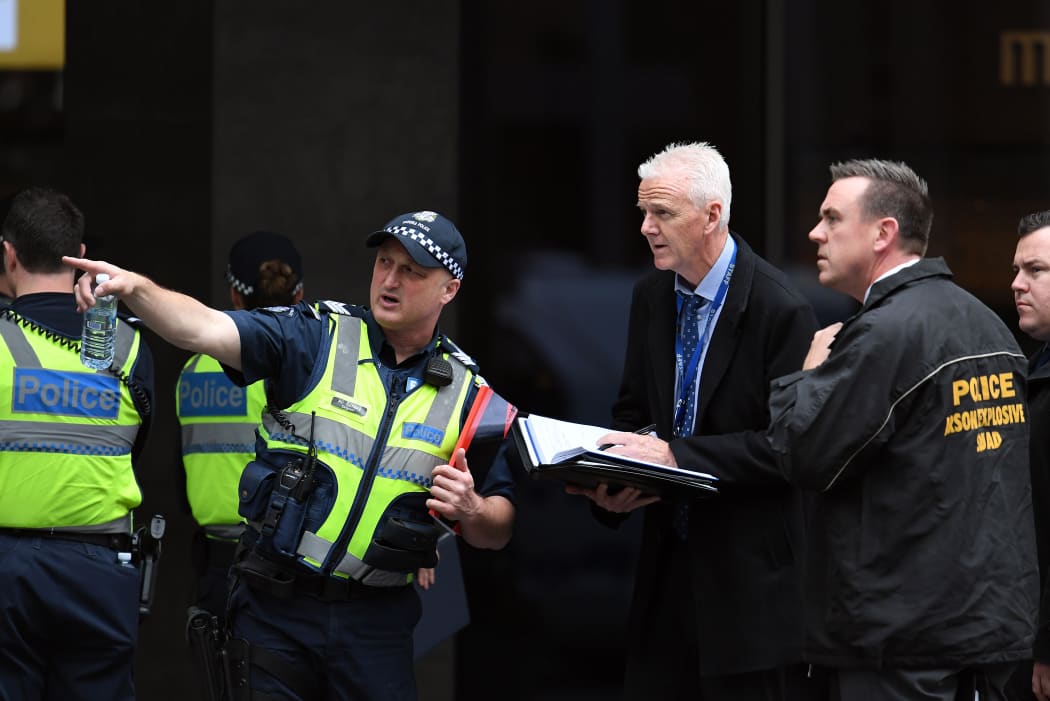Police work at the crime scene following a stabbing incident in Melbourne.