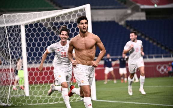 Spain's midfielder Marco Asensio celebrates after scoring the opening goal during the Tokyo 2020 Olympic Games men's semi-final football match between Japan and Spain at Saitama Stadium in Saitama on August 3, 2021.