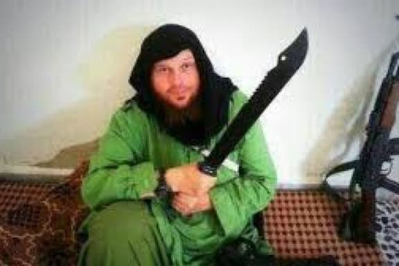 In this image supplied to the ABC, Mark Taylor is pictured posing with a sword.