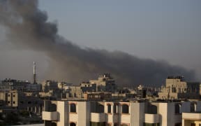 Smoke billows from buildings in Gaza City on Wednesday.