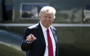 US President Donald Trump walks from Marine One to the White House February 24, 2017 in Washington, DC.