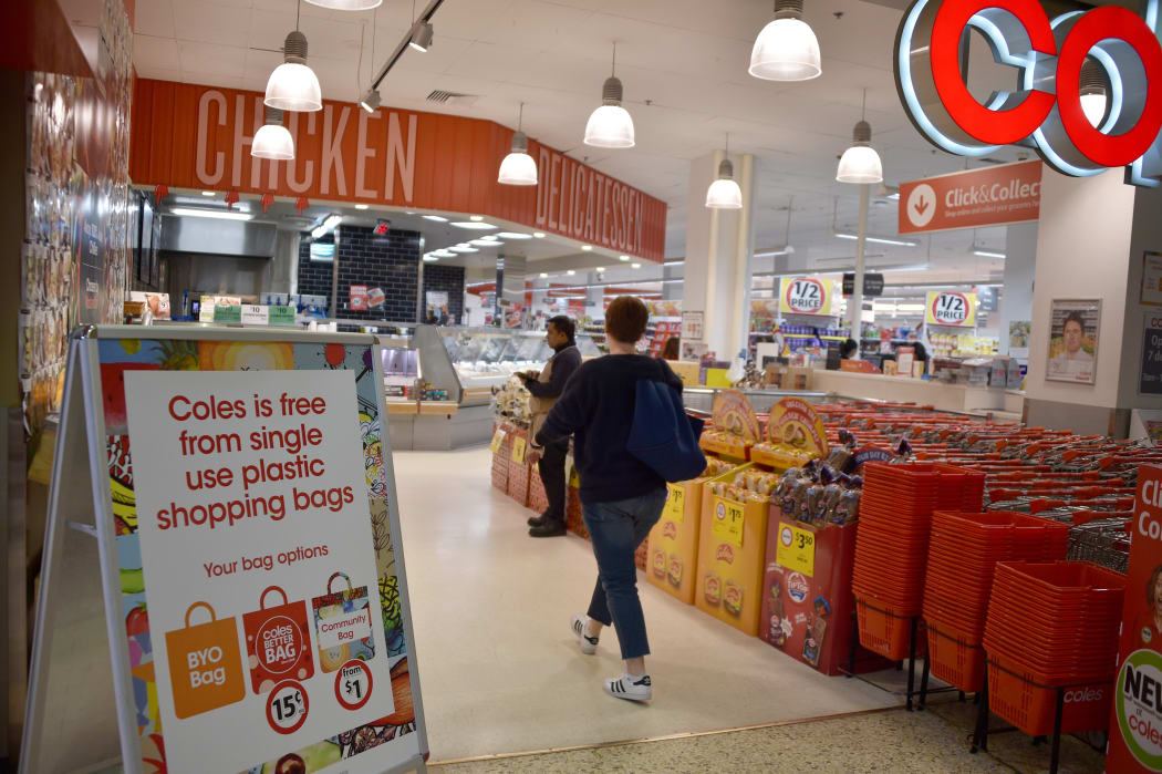 A sign, seen in a Coles supermarket, advises its customers of its plastic bag free in Sydney on July 2, 2018.