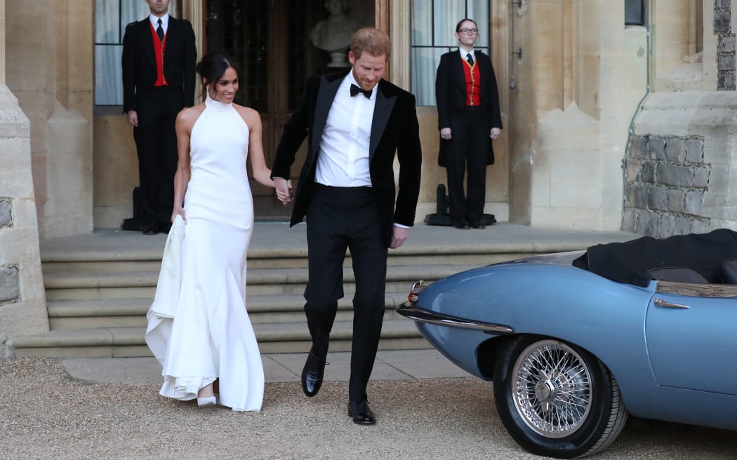Prince Harry and Meghan Markle after their wedding on the way to attending an evening reception at Frogmore House.