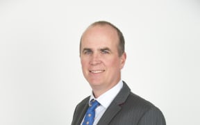 A portrait of immigration lawyer Alastair McClymont.