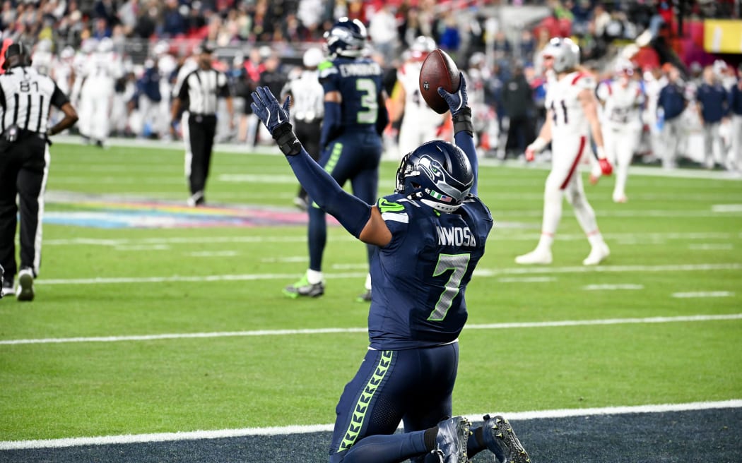 Seattle Seahawks’ linebacker Uchenna Nwosu celebrates scoring a touchdown during Super Bowl LX between the New England Patriots and the Seattle Seahawks at Levi's Stadium in Santa Clara, California on February 8, 2026. (Photo by JOSH EDELSON / AFP)